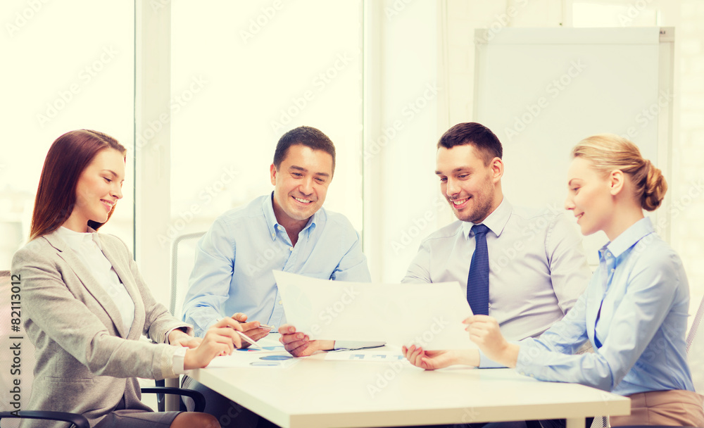 smiling business team having discussion in office smiling business team having discussion in office
