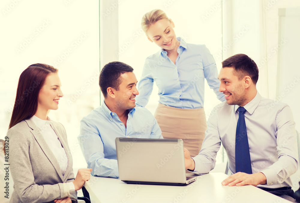 business team working with laptop in office business team working with laptop in office