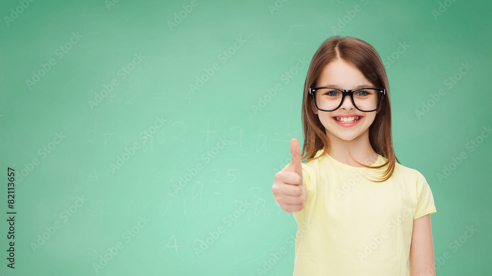 smiling cute little girl in black eyeglasses smiling cute little girl in black eyeglasses