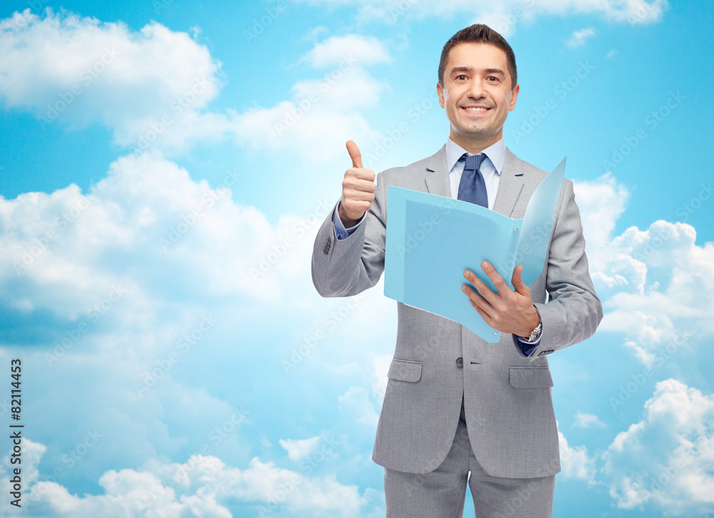 happy businessman with folder showing thumbs up