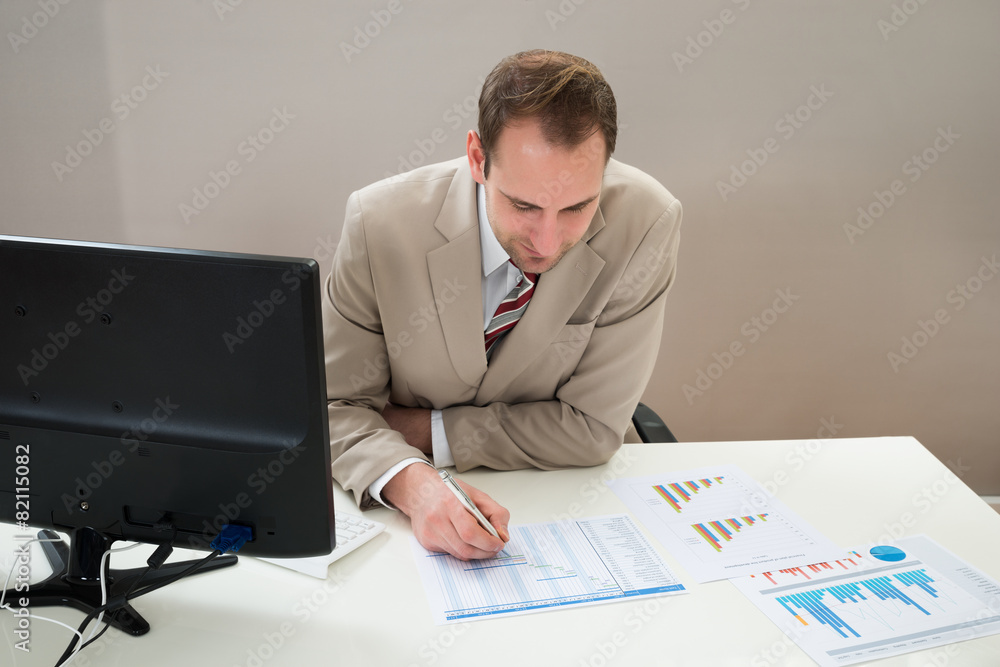 Businessman Making Gantt Diagram In Office Businessman Making Gantt Diagram In Office