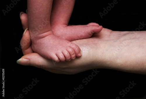 Baby Feet In Mothers Hand