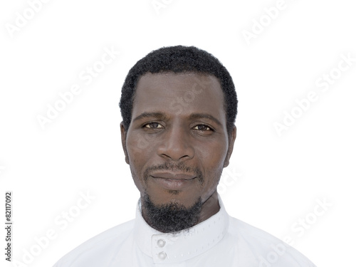 Portrait of an Afro man wearing a white djellaba, isolated