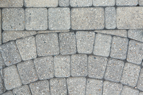 Circular inlaid pattern in grey brickwork