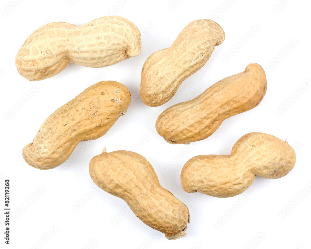 Many peanuts in shells, one upon the other Many peanuts in shells, one upon the other