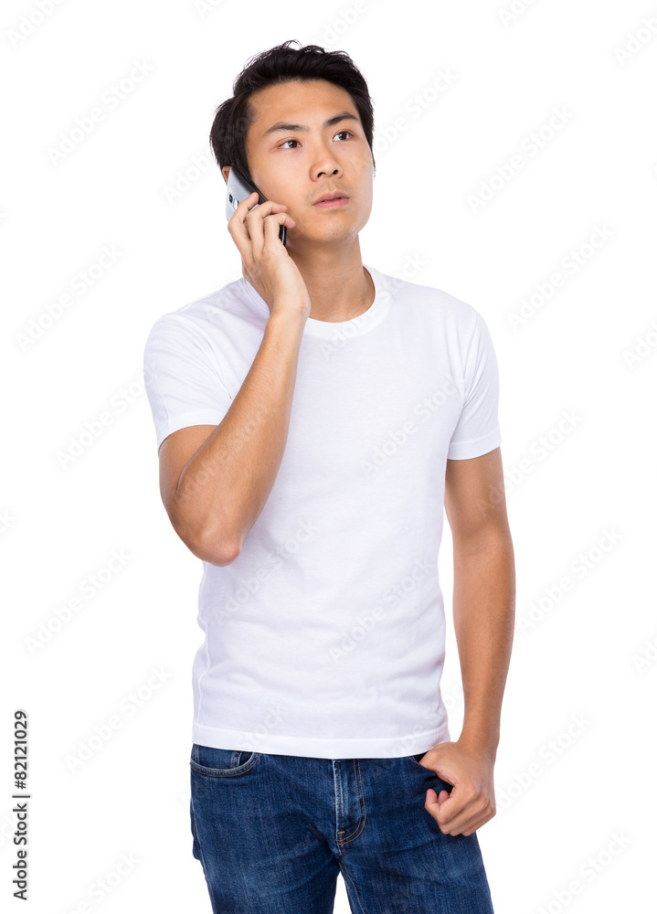 Young man talk to mobile phone Young man talk to mobile phone