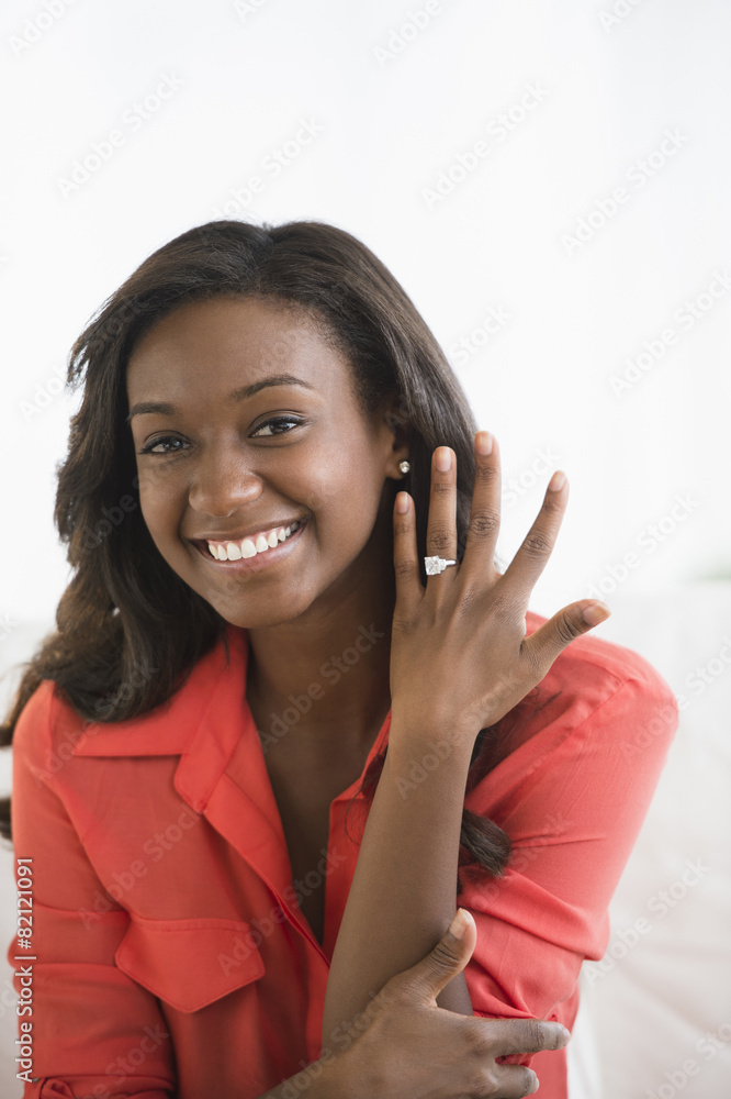 Black woman showing off engagement ring Black woman showing off engagement ring