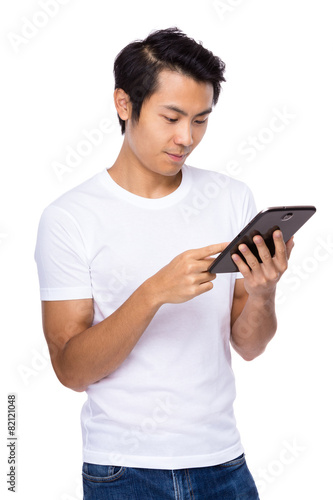 Young man use of digital tablet