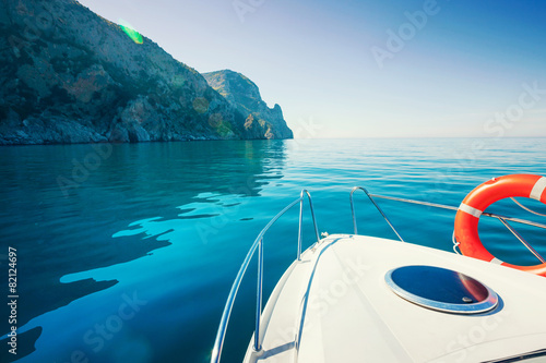 Private boat near mountains. Luxury Lifestyle. Traveling yacht