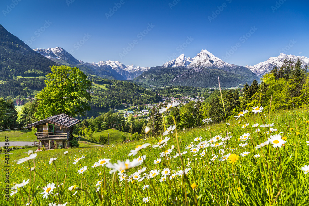 Idyllic landscape in the Alps with mountain lodge in spring