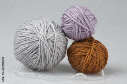 three fawn wool balls