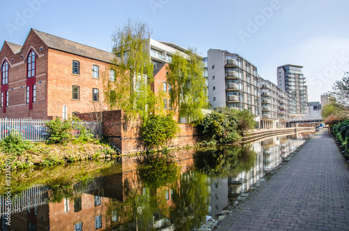 View of canal in Nottingham city centre with old and new buildings photo
