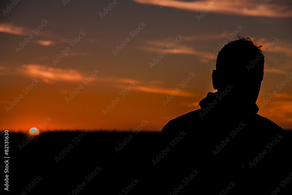 Silhouette of a man  in the sunset