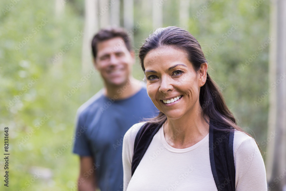 Couple smiling in forest