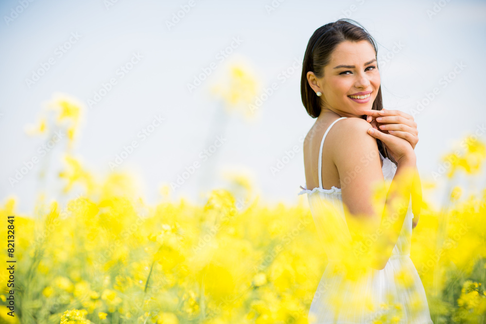 Young woman in the spring field Young woman in the spring field