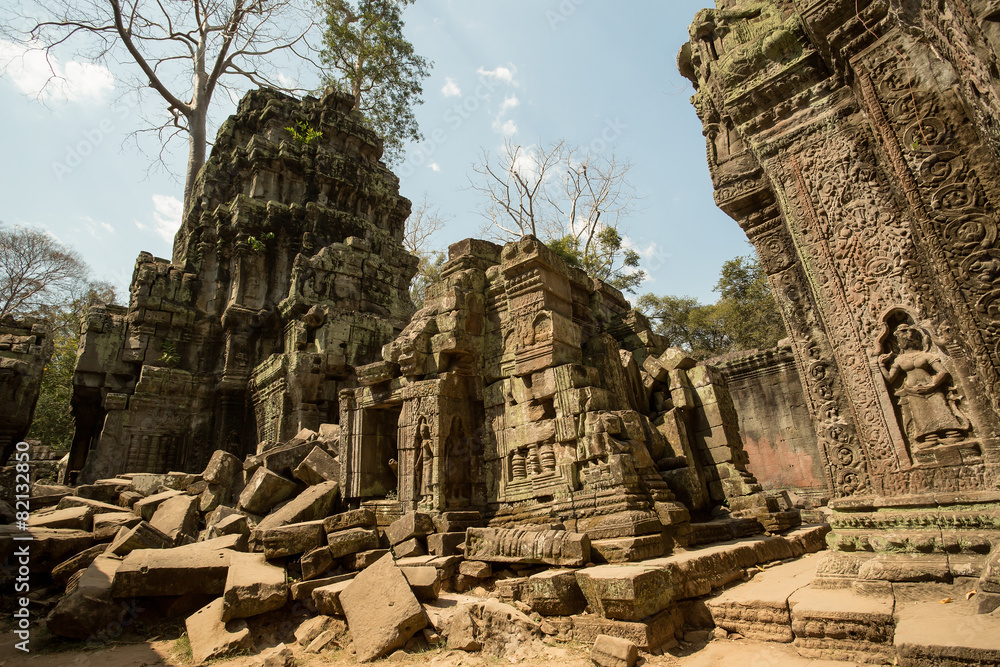 Ta Prohm ruins with carved apsaras and tower