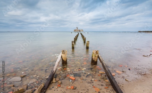 Baltic sandy coast with old military buildings 