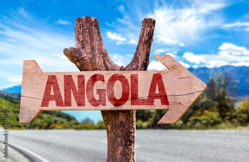 Angola wooden sign with road background