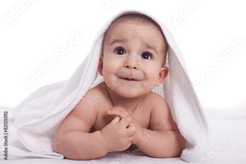 Cute baby with big beautiful eyes after shower