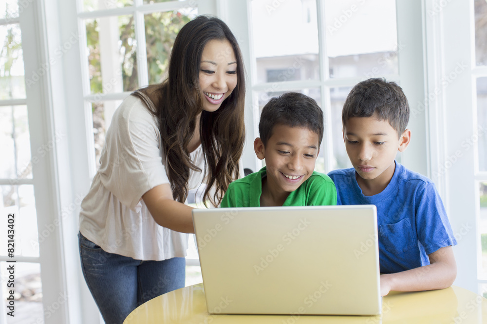 Mother and sons using laptop Mother and sons using laptop