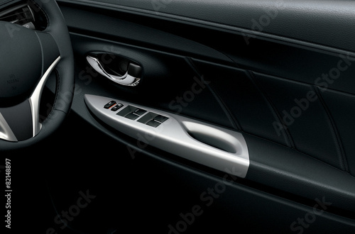 Car interior detail. Closeup of controls on the door