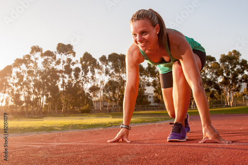 Female runner on an athletics track