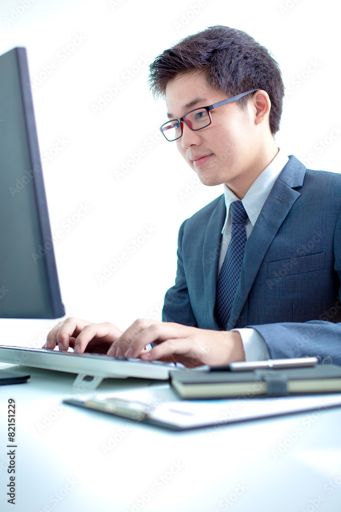 Handsome businessman working with laptop Handsome businessman working with laptop