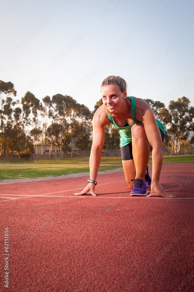 Obraz premium Female runner on an athletics track