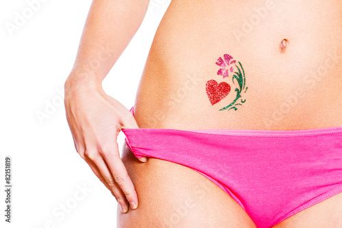 Heart glitter-tattoo with flower isolated