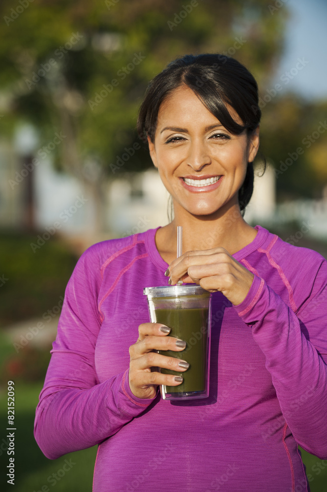 Pregnant Hispanic woman having health drink Pregnant Hispanic woman having health drink