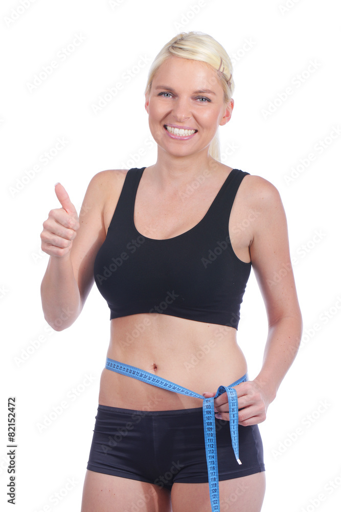Junge Frau mit Maßband um die Taille und Daumen hoch Junge Frau mit Maßband um die Taille und Daumen hoch