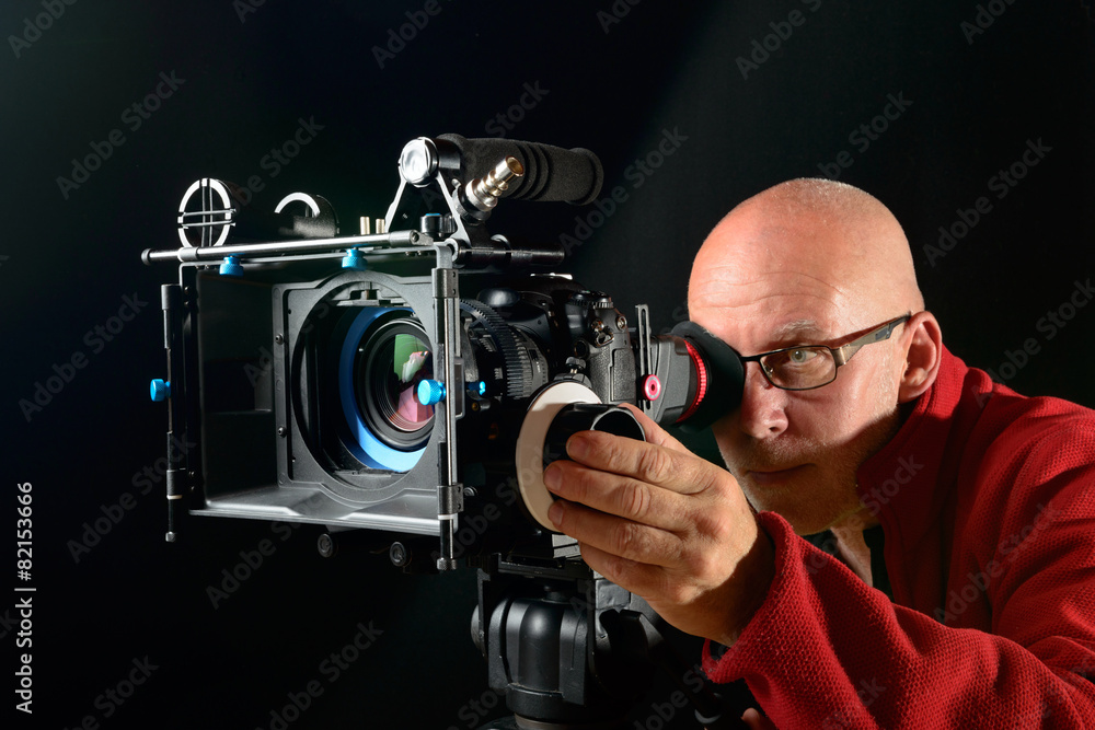 man with a professional movie camera man with a professional movie camera