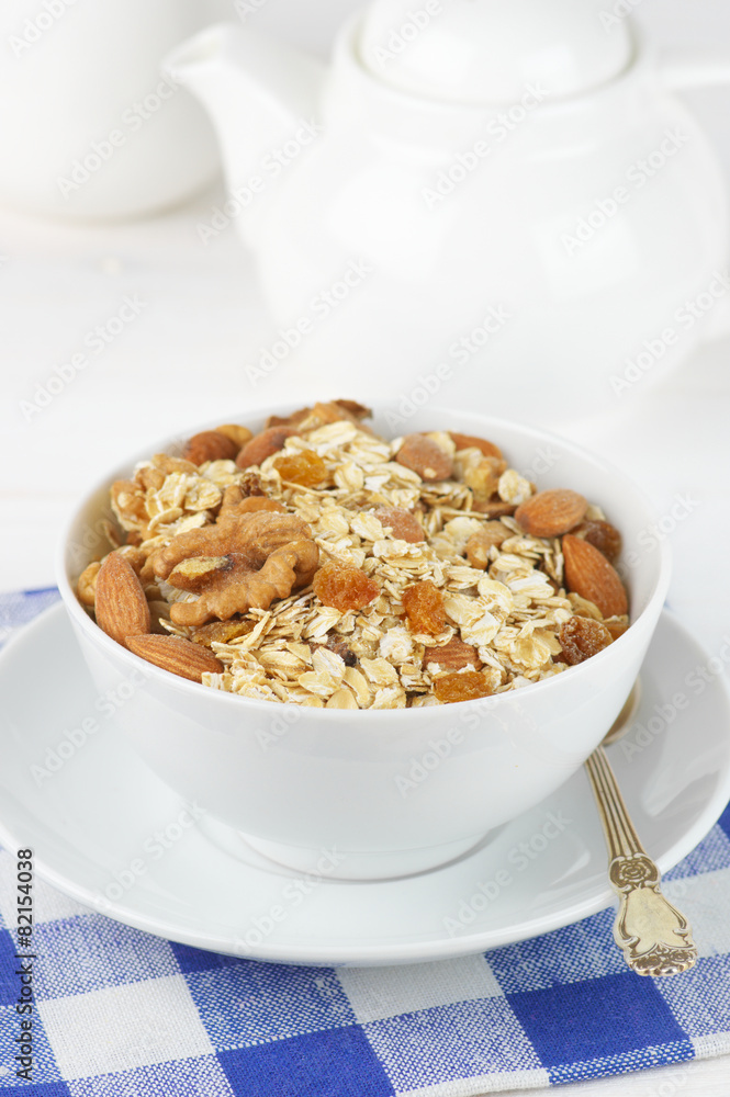 Oatmeal flakes with nuts in bowl Oatmeal flakes with nuts in bowl