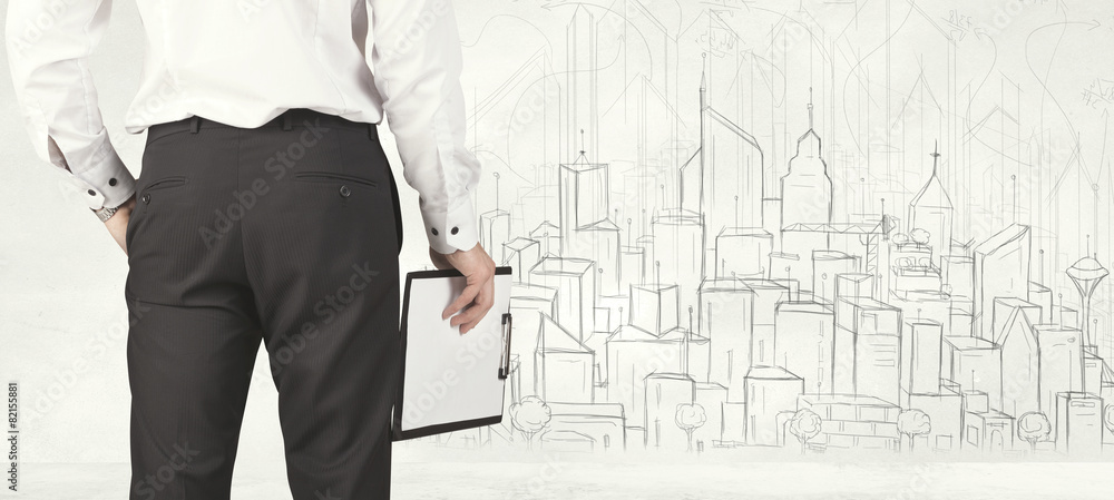 Businessman with drawn city view Businessman with drawn city view