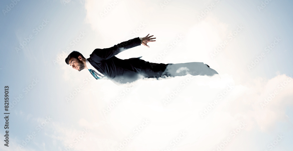 Business man flying like a superhero in clouds on the sky Business man flying like a superhero in clouds on the sky