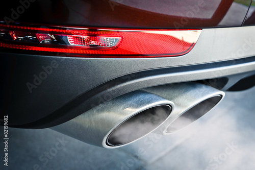 Close up of a car dual exhaust pipe photo