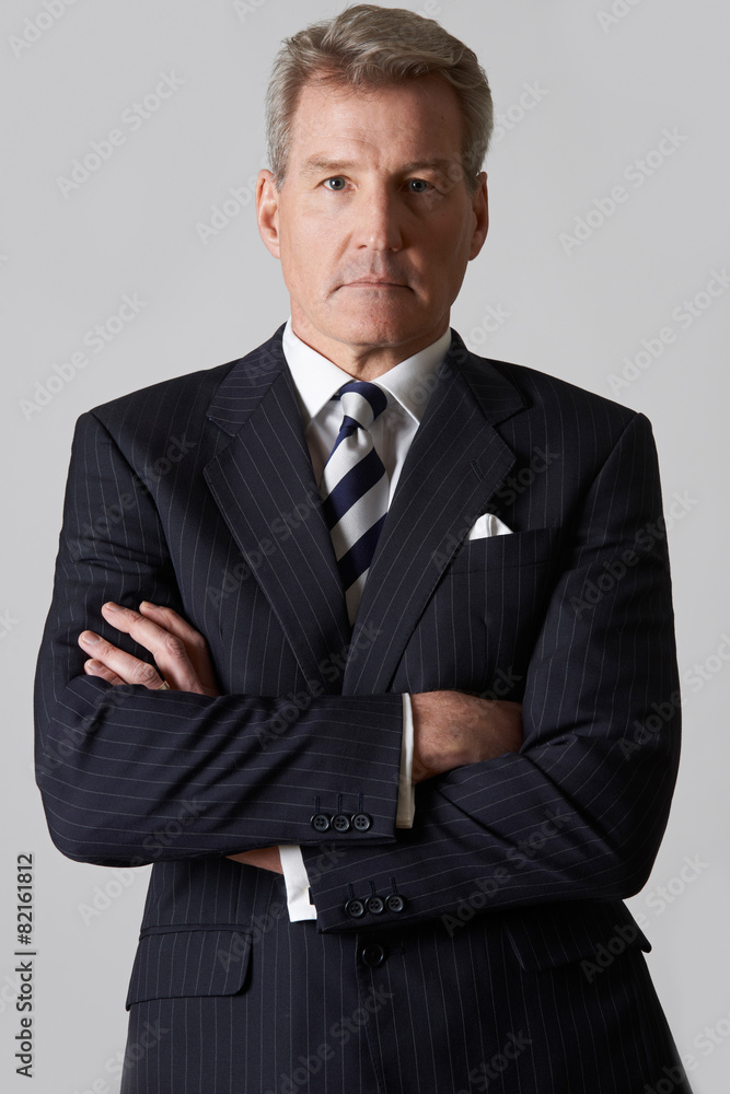 Portrait Of Mature Businessman With Crossed Arms Portrait Of Mature Businessman With Crossed Arms
