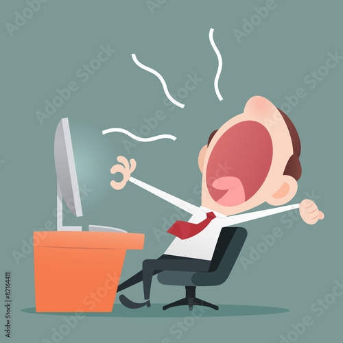 Young business man yawning in the executive chair