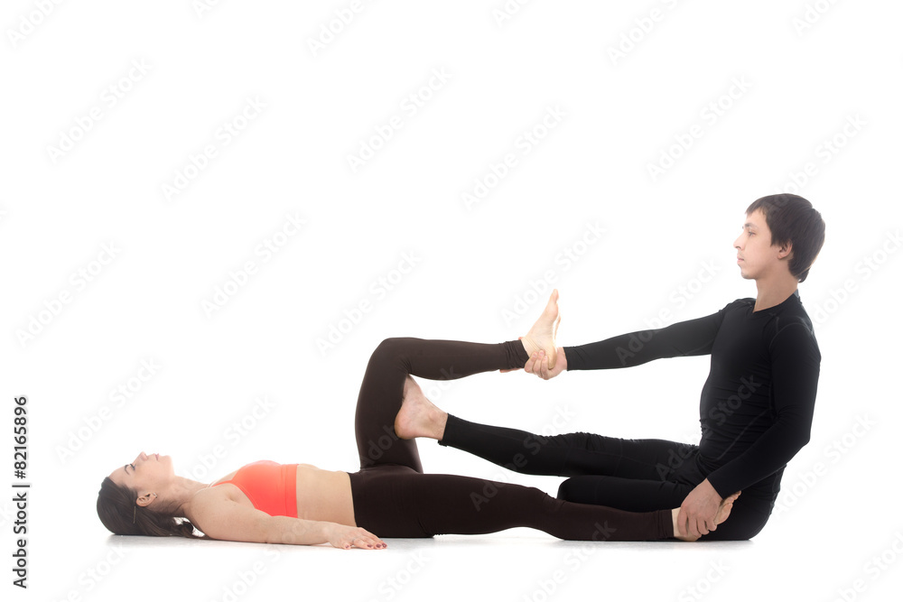 Yogi couple practice yoga together Yogi couple practice yoga together