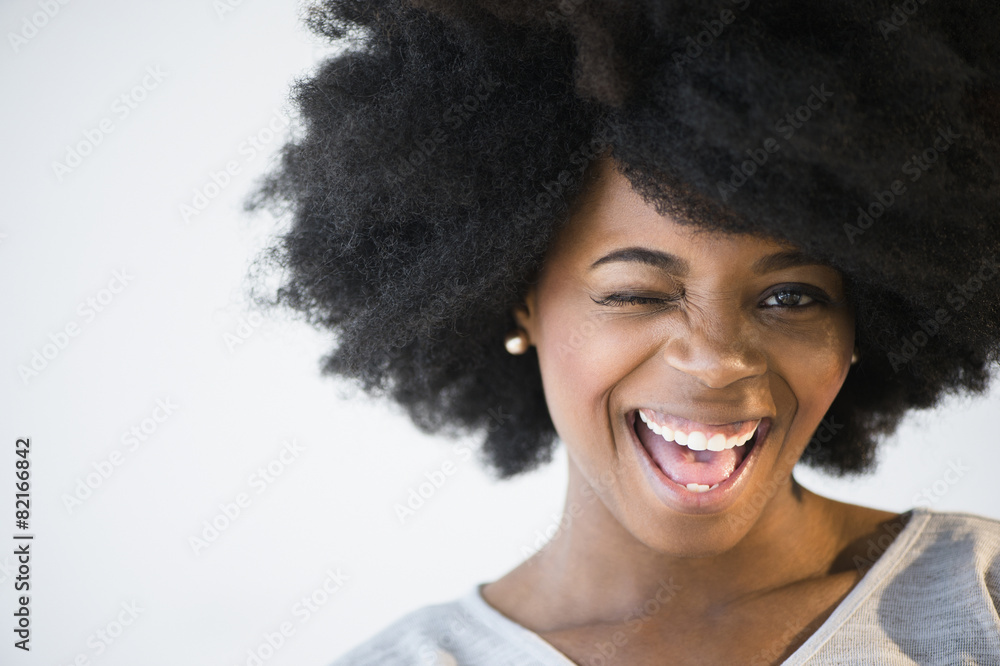 Mixed race woman winking Mixed race woman winking
