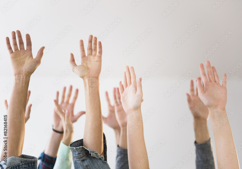 People's hands raised in air People's hands raised in air