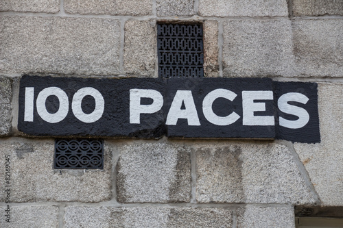 Sign "100 paces" at the Collins Barracks in Dublin, Ireland, 201
