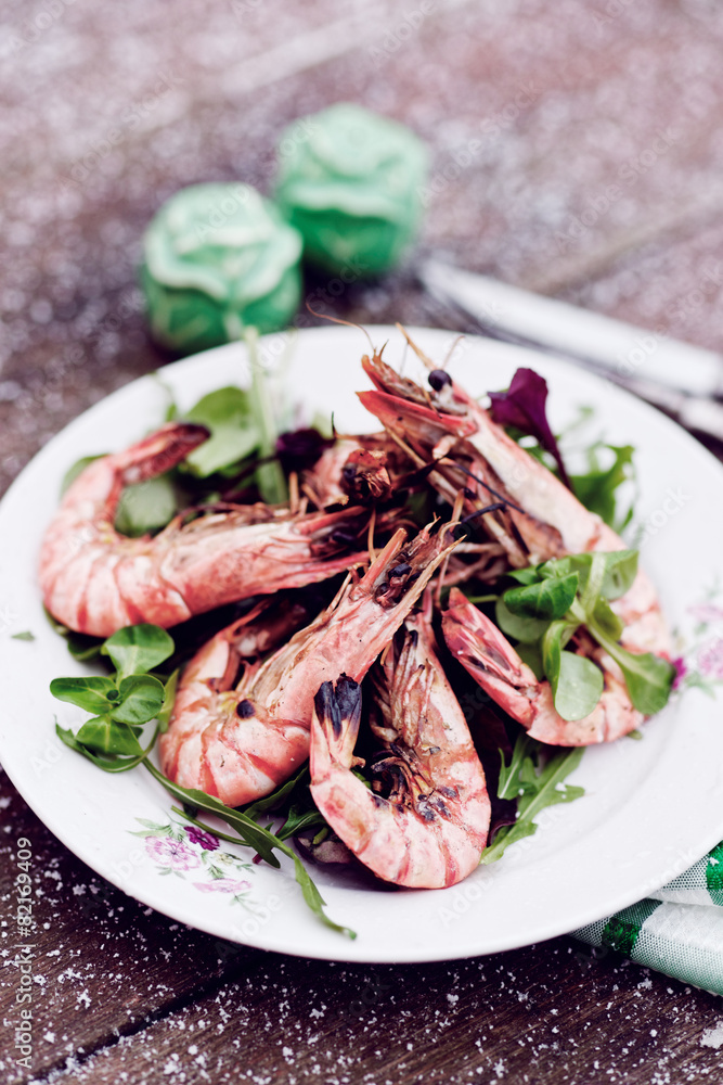 Grilled shrimps served outdoor in winter, toned image Grilled shrimps served outdoor in winter, toned image