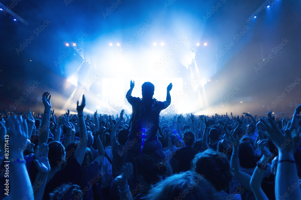 crowd of people at concert in front of the stage with lights - obrazy, fototapety, plakaty 