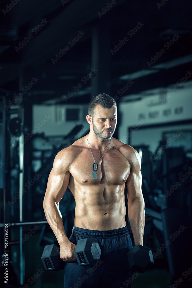 Man doing curls in gym Man doing curls in gym