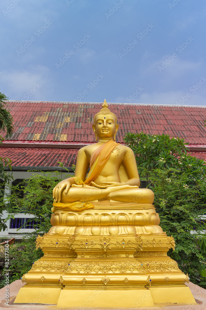 the gold buddha statue sitting under sunlight the gold buddha statue sitting under sunlight