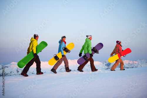 Group of snowboarders on top of the mountain Concept