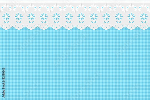 Openwork embroidery on checkered blue pattern background