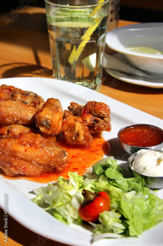 Bbq chicken wings with dips and salad