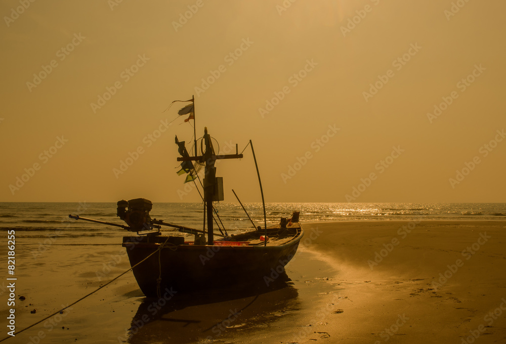 Silhouette of fisherman boat parked on beach. hua hin, Thailand.